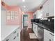Bright kitchen with white cabinets, stainless steel appliances, and ample countertop space at 1420 E Market St, Indianapolis, IN 46201