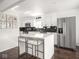 Modern kitchen with stainless steel appliances and a center island at 1420 E Market St, Indianapolis, IN 46201