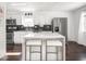 Bright kitchen featuring a center island, stainless appliances and dark wood flooring at 1420 E Market St, Indianapolis, IN 46201