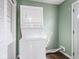 Convenient laundry area with a stackable washer and dryer unit and a nearby door at 1420 E Market St, Indianapolis, IN 46201