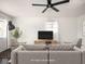 Comfortable living room featuring stylish furniture and a ceiling fan at 1420 E Market St, Indianapolis, IN 46201