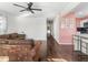 Cozy living room featuring hardwood floors, modern lighting, and seamless flow to the open kitchen at 1420 E Market St, Indianapolis, IN 46201