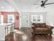 Open-concept living room with a kitchen view, hardwood floors, and a comfortable seating area at 1420 E Market St, Indianapolis, IN 46201