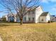 Back exterior view showing the home with a traditional style and landscaping at 1535 Arbor Springs Dr, Brownsburg, IN 46112