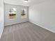 Bedroom with carpet, flush mount light, and two windows at 1535 Arbor Springs Dr, Brownsburg, IN 46112