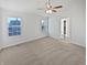 Spacious bedroom with multiple windows offering ample natural light and neutral carpet at 1535 Arbor Springs Dr, Brownsburg, IN 46112