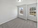 Bedroom with carpet and two windows looking onto the neighborhood at 1535 Arbor Springs Dr, Brownsburg, IN 46112