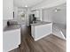 Modern kitchen with white cabinetry, stainless steel appliances, and stylish finishes at 1535 Arbor Springs Dr, Brownsburg, IN 46112