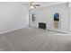 Spacious living room with fireplace, ceiling fan and bright white trim at 1535 Arbor Springs Dr, Brownsburg, IN 46112