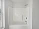 Clean white shower enclosure with modern fixtures and window for natural light at 1535 Arbor Springs Dr, Brownsburg, IN 46112