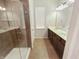 Modern bathroom featuring a double vanity, walk-in shower, and neutral tile flooring at 1670 Rossmay Dr, Westfield, IN 46074