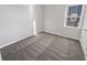 A simple bedroom with a gray carpet and white trim at 1670 Rossmay Dr, Westfield, IN 46074