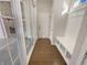 Bright entryway features wood floors, storage bench, and coat hooks at 1670 Rossmay Dr, Westfield, IN 46074