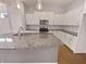 A kitchen with a large island and stainless steel appliances at 1670 Rossmay Dr, Westfield, IN 46074