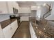 Well-equipped kitchen with stainless steel appliances, granite countertops, and white cabinetry at 1670 Rossmay Dr, Westfield, IN 46074