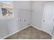 A simple laundry room with shelving and tile floors at 1670 Rossmay Dr, Westfield, IN 46074