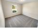 Bedroom with neutral walls, carpeting and a window looking out to green landscape at 170 Trails End, Brownsburg, IN 46112