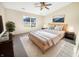 Cozy bedroom with a ceiling fan, large window, and plush carpet at 170 Trails End, Brownsburg, IN 46112