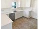 Kitchen featuring white cabinets, white countertops, stainless steel appliances, and a window above the sink at 170 Trails End, Brownsburg, IN 46112