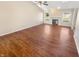 Spacious living room with wood floors, fireplace, ceiling fan and large windows bringing in lots of natural light at 170 Trails End, Brownsburg, IN 46112