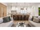 Open-concept living area with kitchen island, modern lighting, and hardwood floors at 1802 Central Ave, Indianapolis, IN 46202