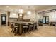Well-appointed kitchen featuring a large island with seating and stylish pendant lighting, and open concept design at 1813 Milford St, Carmel, IN 46032