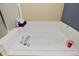 Beautiful bathroom with a large white bathtub, perfect for relaxation at 1905 Windsor Ln, Danville, IN 46122