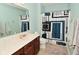 Bathroom showcasing a sink vanity, toilet, mirror, and a patterned shower curtain at 1905 Windsor Ln, Danville, IN 46122
