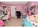 Vibrant bedroom with pink walls, gaming setups, and playful decor at 1905 Windsor Ln, Danville, IN 46122