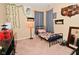 Comfortable bedroom with calming decor, cozy bed, and ample natural light streaming through the curtains at 1905 Windsor Ln, Danville, IN 46122