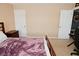 Neutral bedroom with wooden bed frame and a view of the gaming desk area at 1905 Windsor Ln, Danville, IN 46122