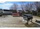 Spacious wooden deck featuring a grill, ideal for outdoor gatherings and barbecues at 1905 Windsor Ln, Danville, IN 46122