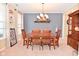 Cozy dining room with classic chandelier and decorative elements, next to large windows at 1905 Windsor Ln, Danville, IN 46122