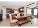 Open concept kitchen with wooden table, bench, and chairs, seamlessly connecting to the living space at 1905 Windsor Ln, Danville, IN 46122