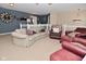 Cozy living room features neutral carpet, furniture, and warm lighting at 1905 Windsor Ln, Danville, IN 46122