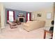Warm living room featuring a brick fireplace, cozy seating, and large windows at 1905 Windsor Ln, Danville, IN 46122