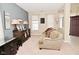 Inviting living room features neutral walls, plush sofa, curated décor and seamless flow at 1905 Windsor Ln, Danville, IN 46122