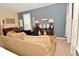 Cozy living room featuring neutral walls, comfortable sofa, curated décor and a vintage piano at 1905 Windsor Ln, Danville, IN 46122