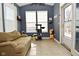 Bright sunroom with ample light, tiled floors, and a cozy couch, perfect for relaxing at 1905 Windsor Ln, Danville, IN 46122