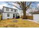 Wide view of backyard with firepit and a mature tree at 1912 Glenridge Dr, Indianapolis, IN 46218