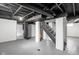Unfinished basement with painted ceiling, support beams, and concrete floor at 1912 Glenridge Dr, Indianapolis, IN 46218
