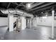 Spacious basement area showing plumbing, HVAC system, and concrete floor at 1912 Glenridge Dr, Indianapolis, IN 46218