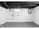 Unfinished basement with painted walls and exposed pipes at 1912 Glenridge Dr, Indianapolis, IN 46218
