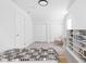 Bright bedroom with built-in shelving, storage, and neutral walls with a comfortable bed at 1912 Glenridge Dr, Indianapolis, IN 46218