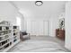 Bedroom with sloped ceiling, built-in shelving, and a cozy seating area at 1912 Glenridge Dr, Indianapolis, IN 46218