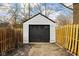 The garage is adjacent to a fenced backyard and provides off-street parking at 1912 Glenridge Dr, Indianapolis, IN 46218