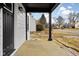 View from porch showing the view of the neighborhood with black pillars and black trim at 1912 Glenridge Dr, Indianapolis, IN 46218