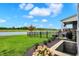 Picturesque backyard with iron fencing, landscaping, and lovely views of the waterfront at 19795 Chatham Shore Ln, Westfield, IN 46074