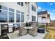 Backyard features patio with seating, grill, and outdoor furniture at 19795 Chatham Shore Ln, Westfield, IN 46074