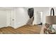 Finished basement area showcases hardwood floors and a staircase with black accents for an open and modern feel at 19795 Chatham Shore Ln, Westfield, IN 46074